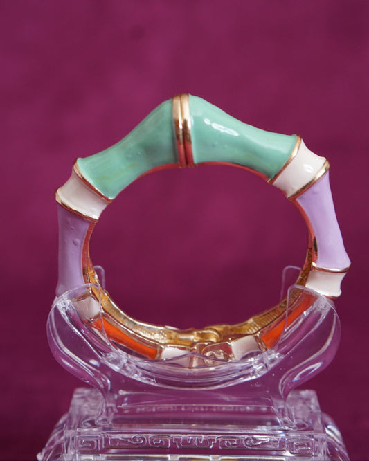 Hinged bangle sculpted like bamboo segments, each enameled in a different pastel color