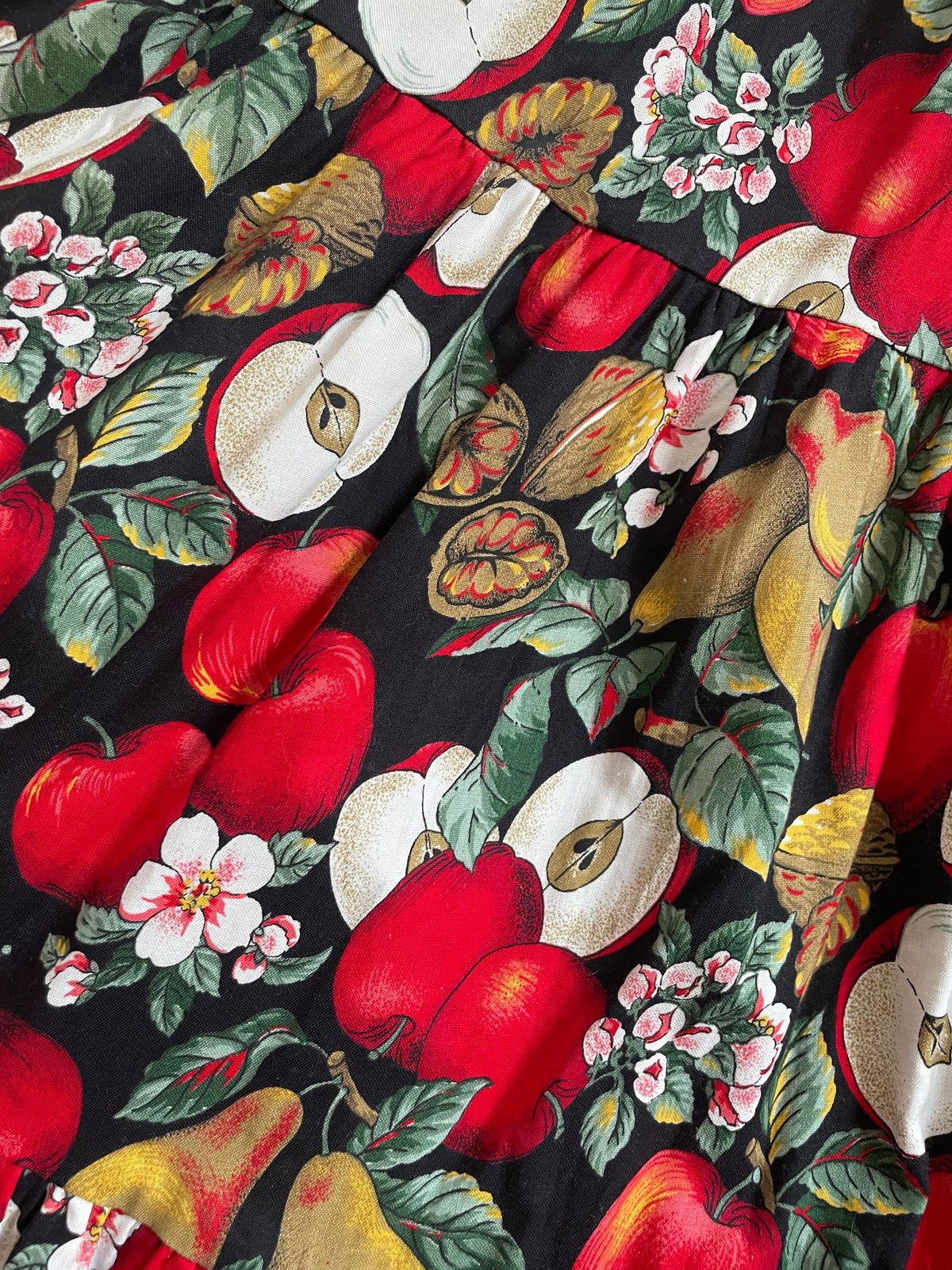 Vintage handmade tiered maxi skirt with an apple, pear, and blossom print on a black ground