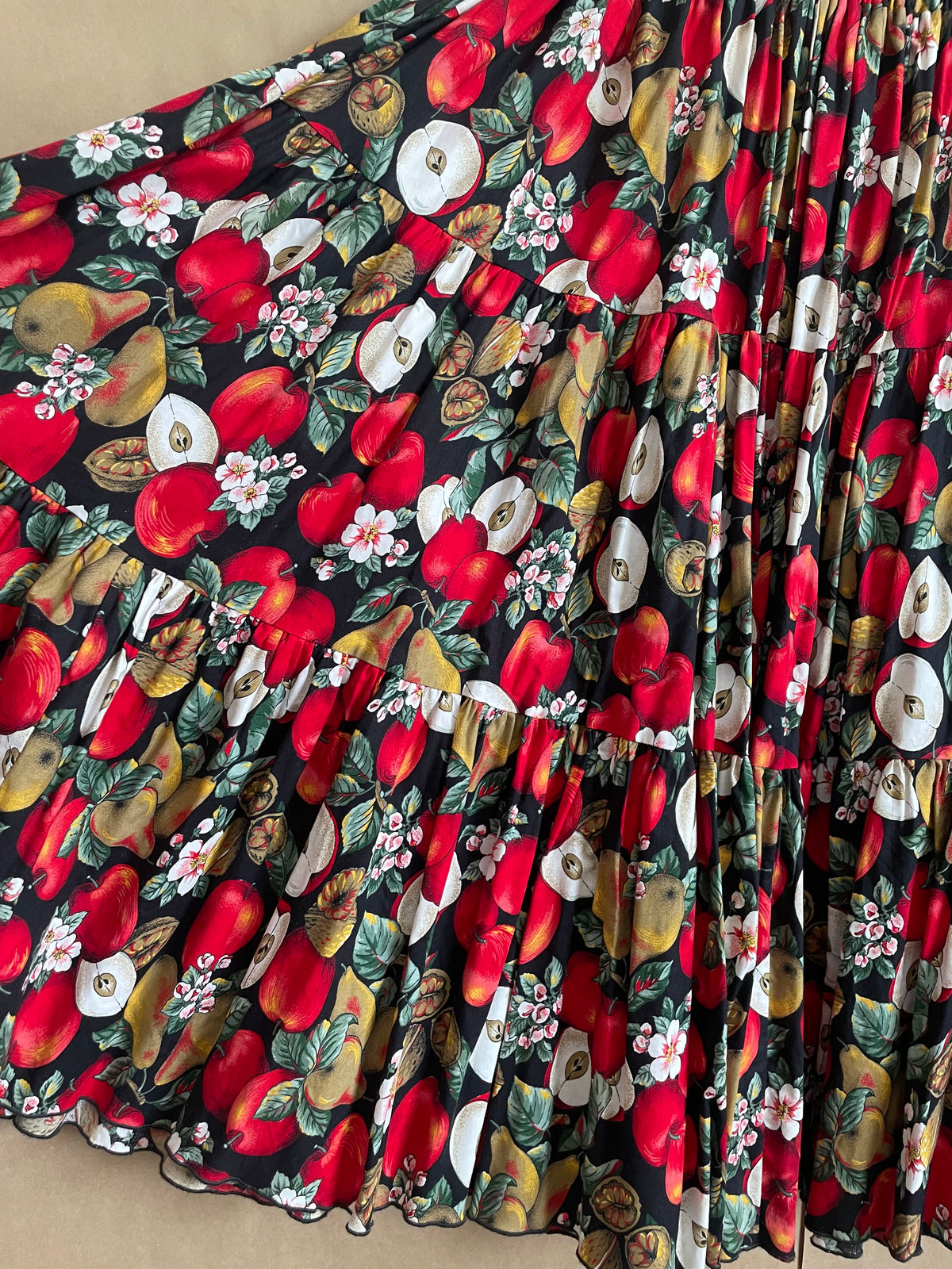 Vintage handmade tiered maxi skirt with an apple, pear, and blossom print on a black ground