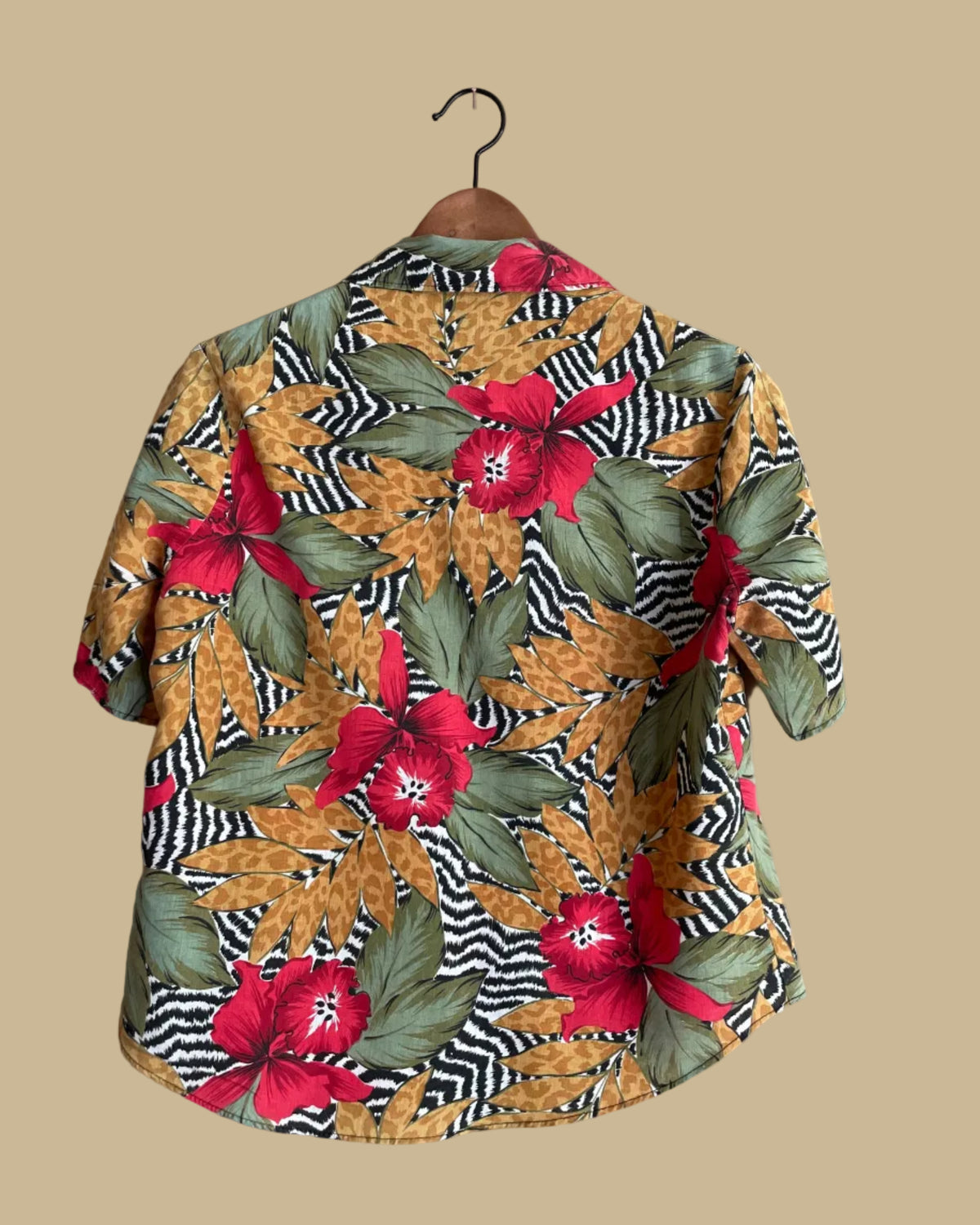 Close-up of the tropical floral print layered over zebra and leopard print fabric