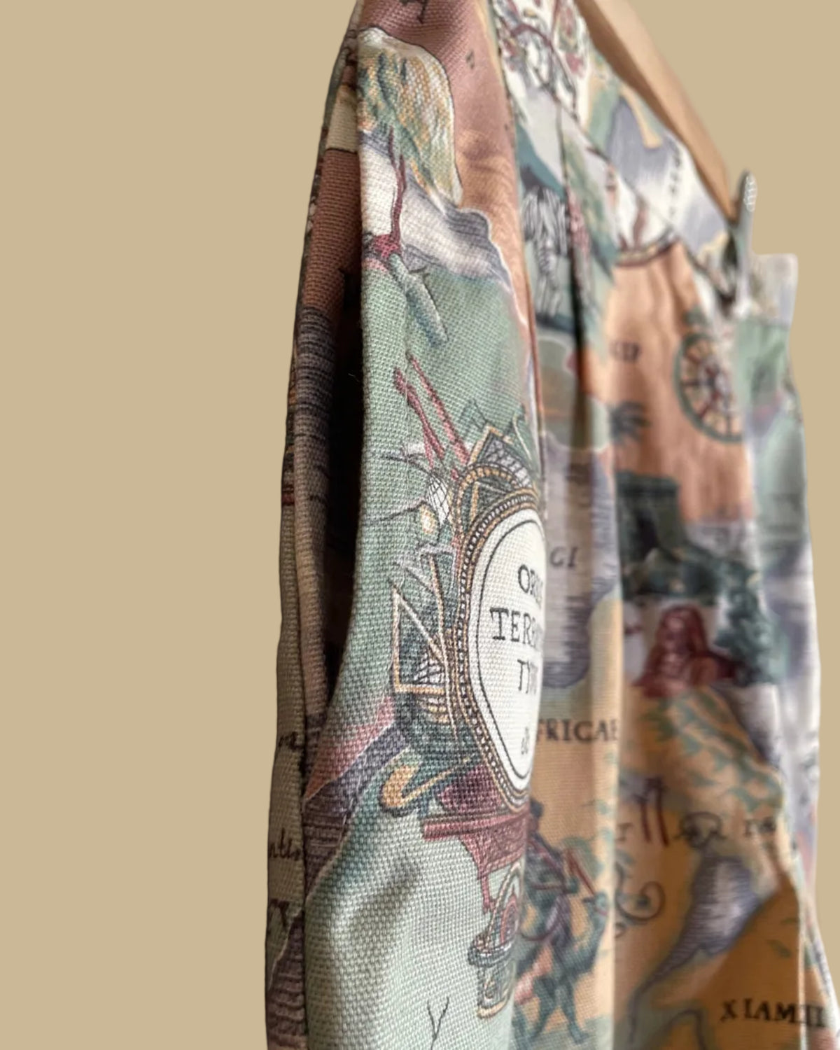 Close-up of the vintage map cartography print fabric on the high-waisted shorts