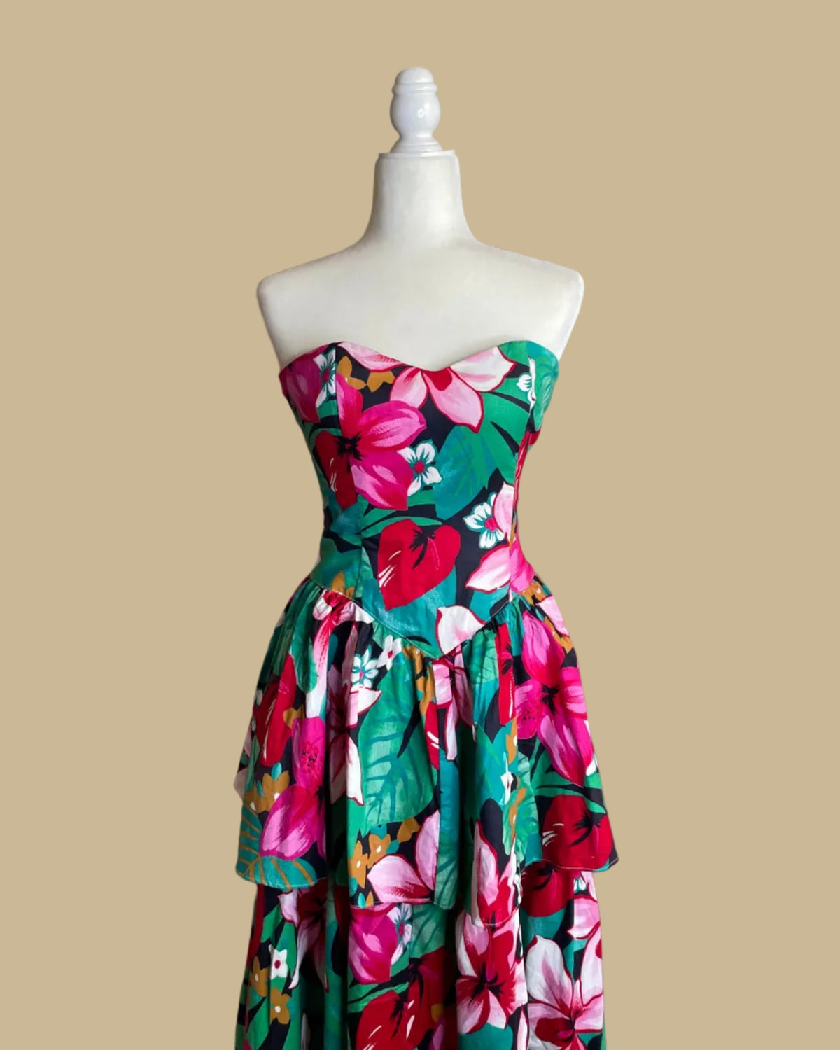 Close-up of the smocked back detail on the tropical floral strapless dress