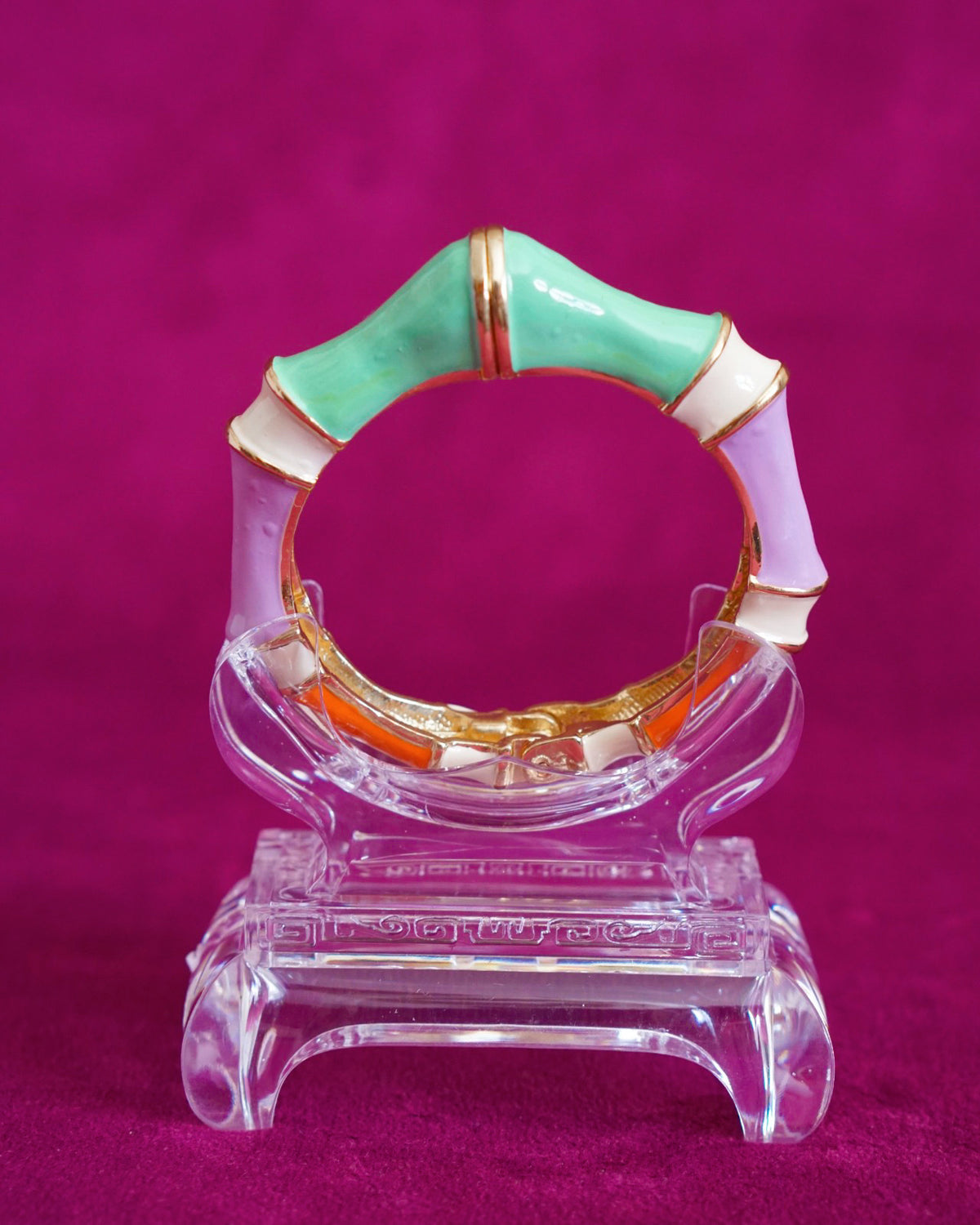 Hinged bangle sculpted like bamboo segments, each enameled in a different pastel color
