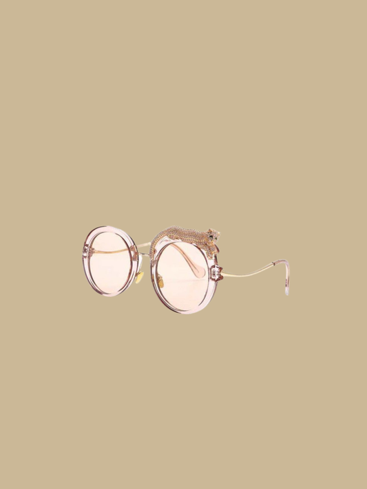Close-up of the jeweled leopard detail on the Fierce Feline Rosé Champagne sunglasses