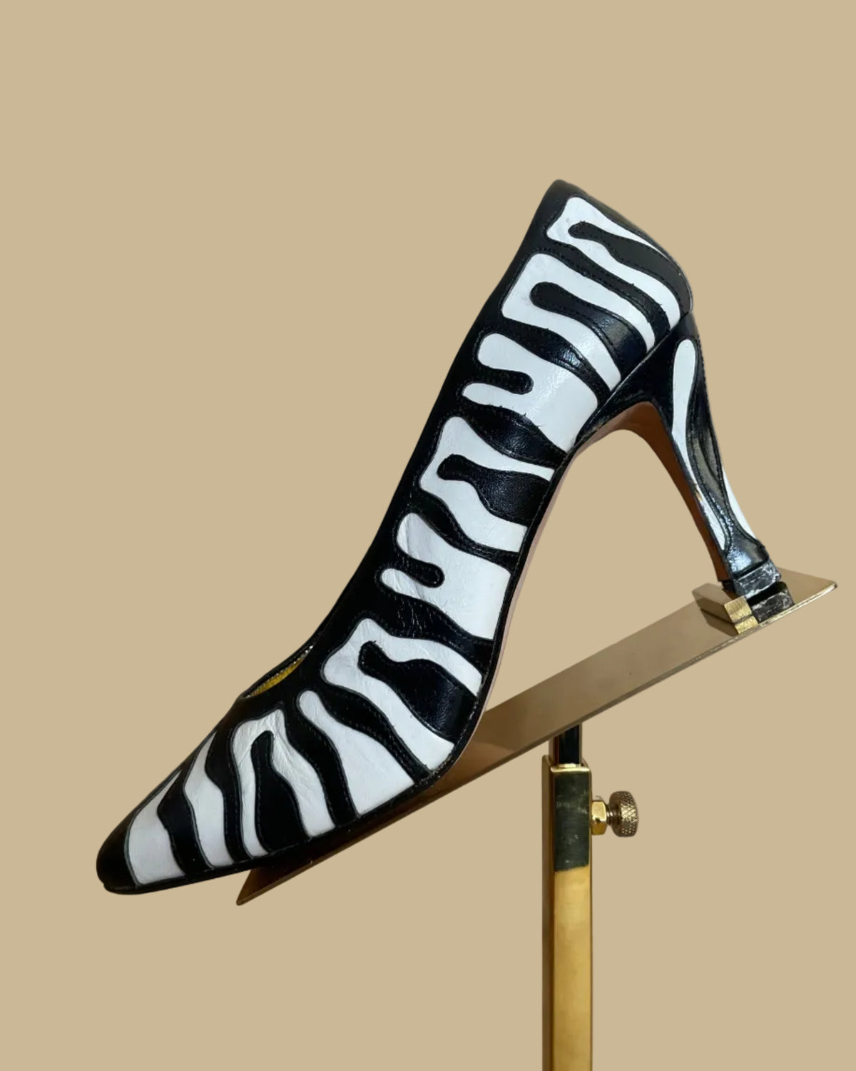 Side view of the vintage Zalo zebra print heels showing the heel height