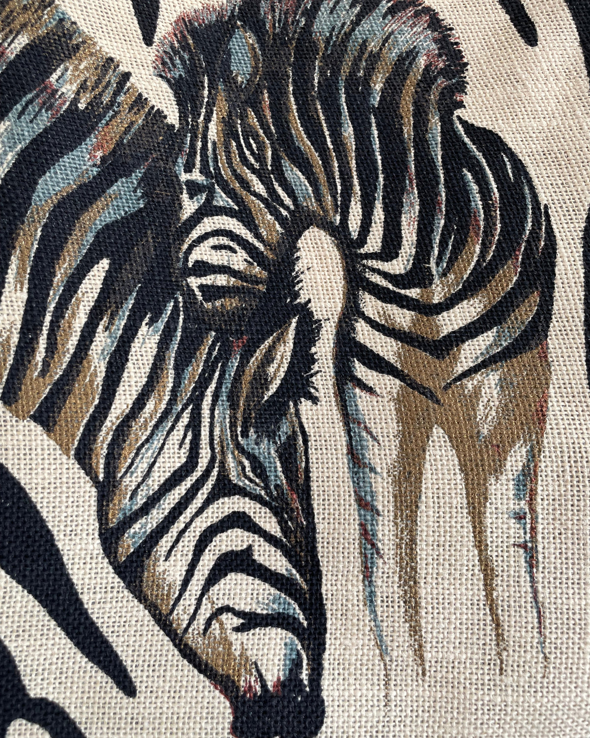 A vintage handmade zebra print canvas tote bag with bamboo handles and a fabric shoulder strap, shown against a kraft background