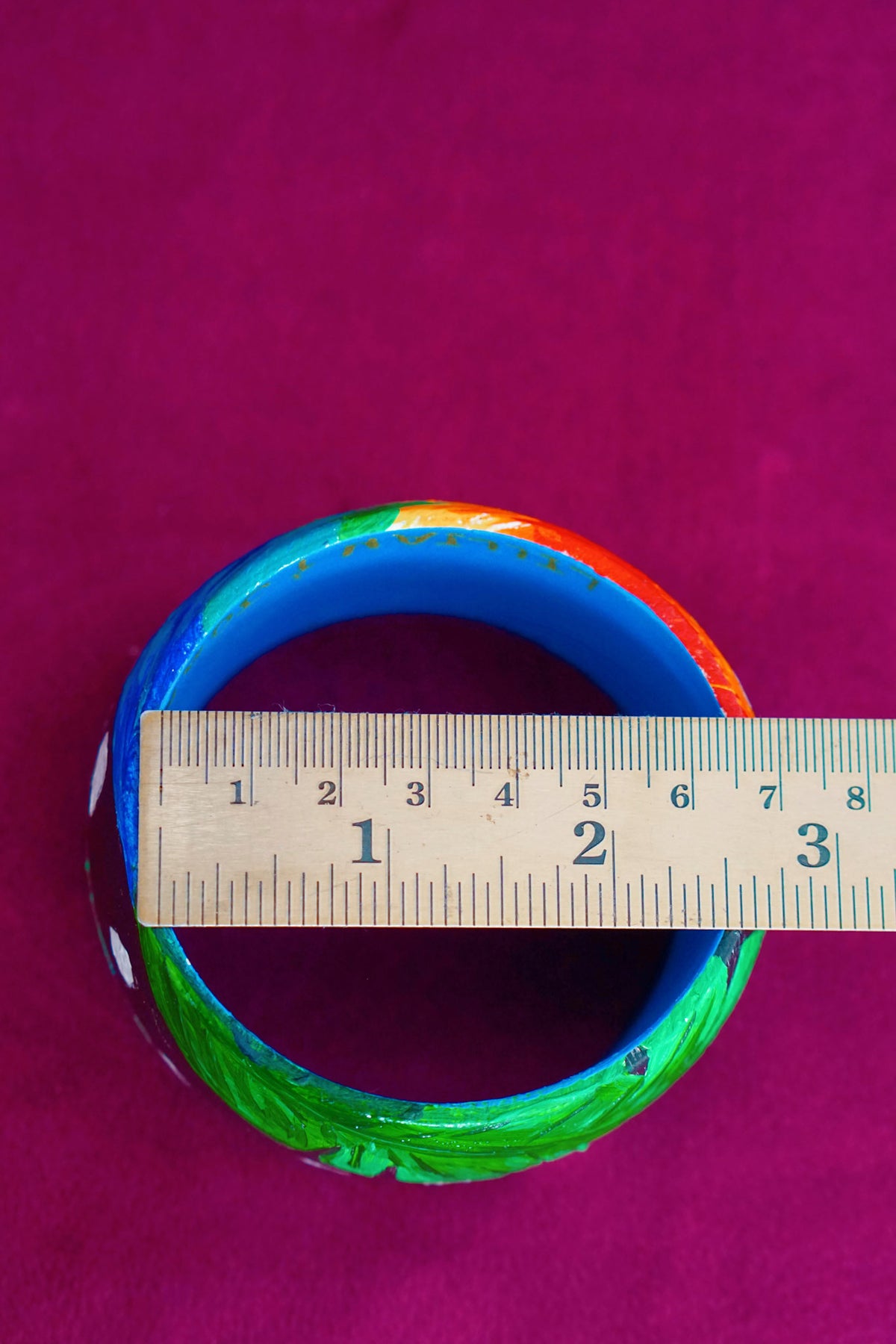 Tropical art bangle with scarlet macaw design by Lillian & Joan