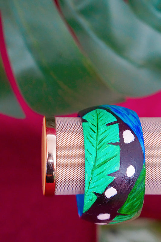 Tropical art bangle with scarlet macaw design by Lillian & Joan