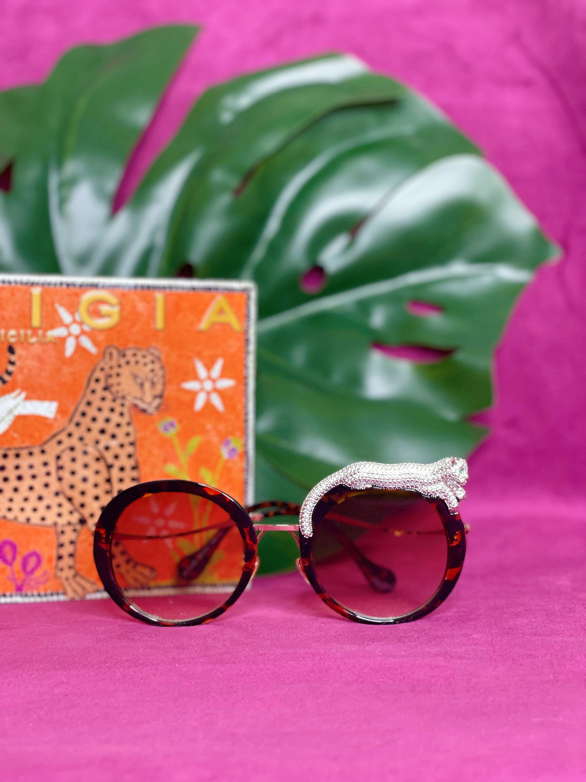 Side view of the Fierce Feline Tortoise Brown sunglasses showing the leopard figure and lens