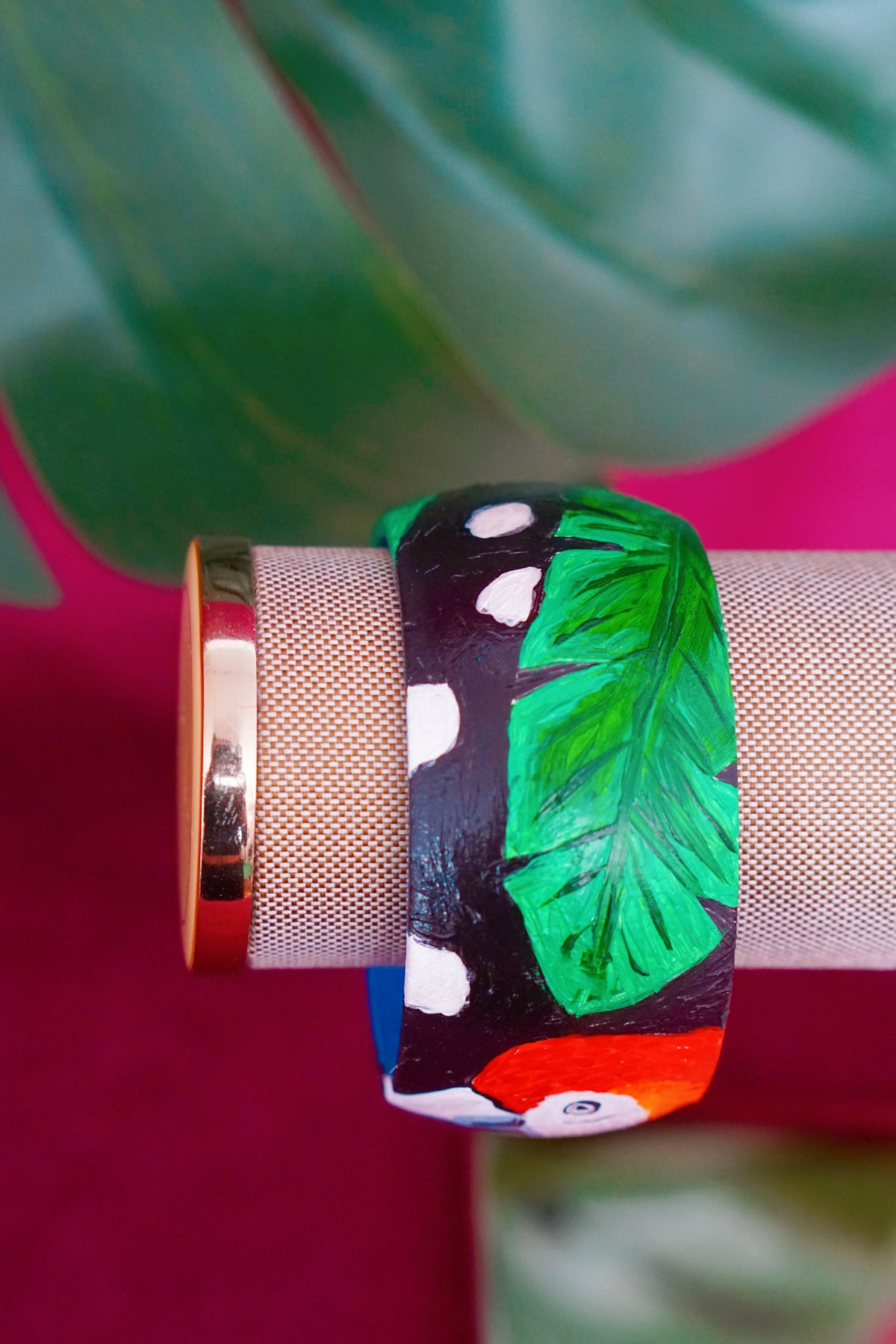 Tropical art bangle with scarlet macaw design by Lillian & Joan