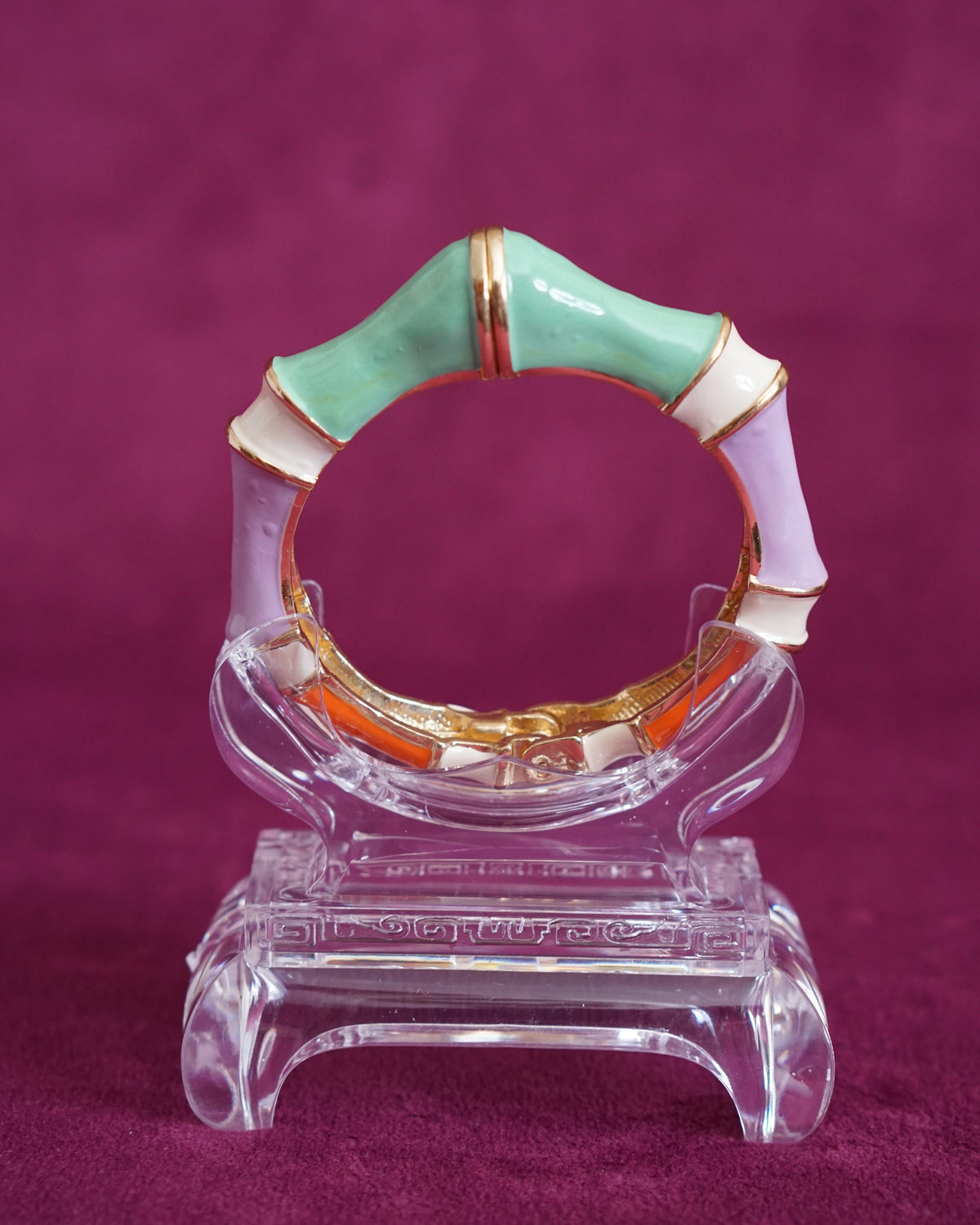 Hinged bangle sculpted like bamboo segments, each enameled in a different pastel color