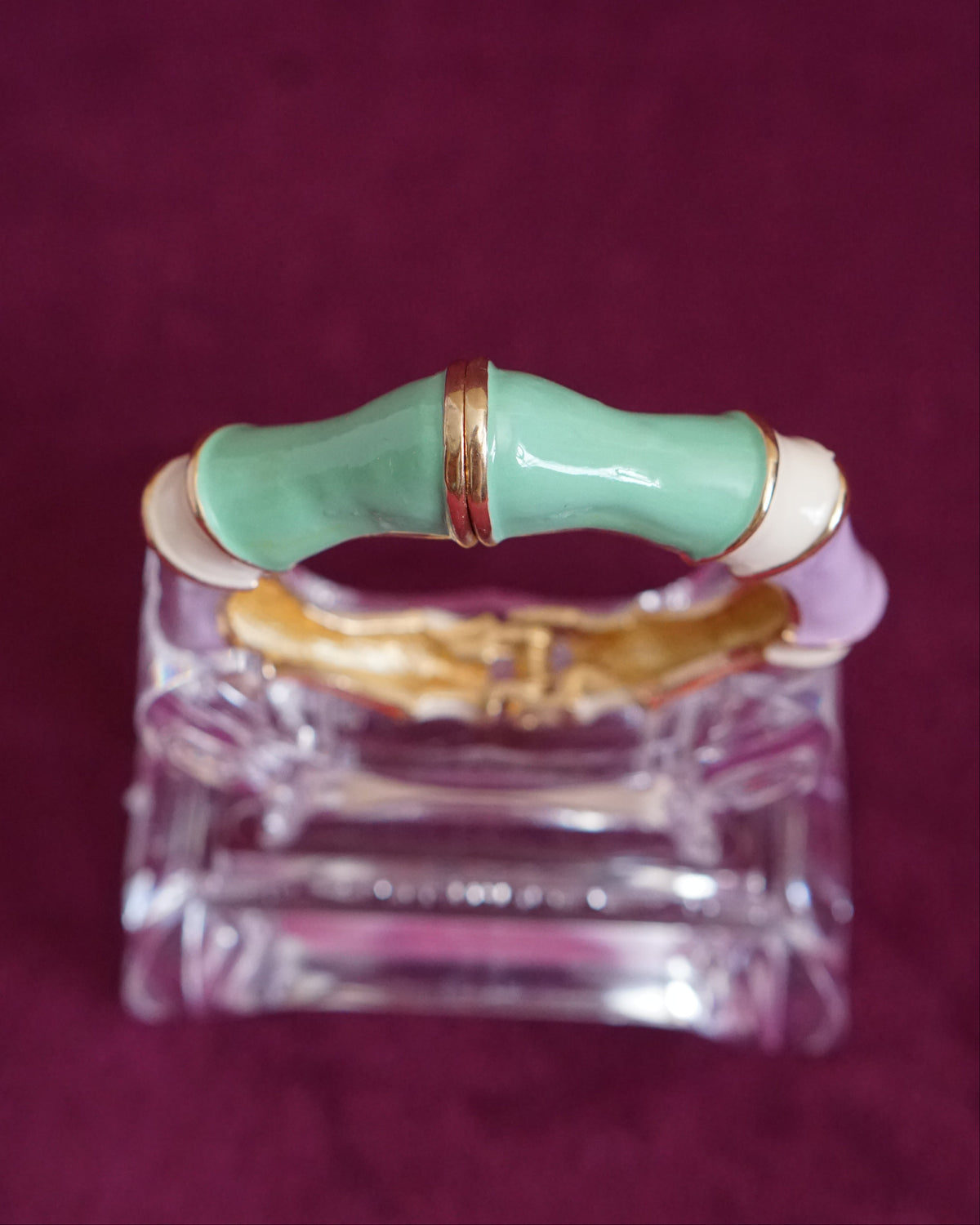 Hinged bangle sculpted like bamboo segments, each enameled in a different pastel color