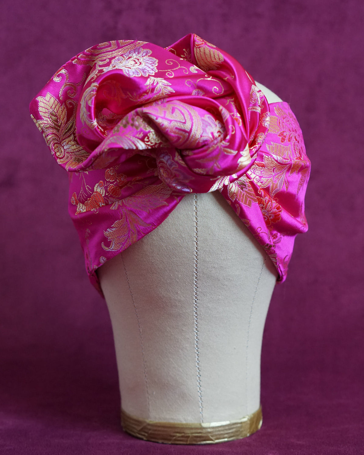 Handmade wired turban headband in fuchsia and gold satin brocade woven with lush blooms