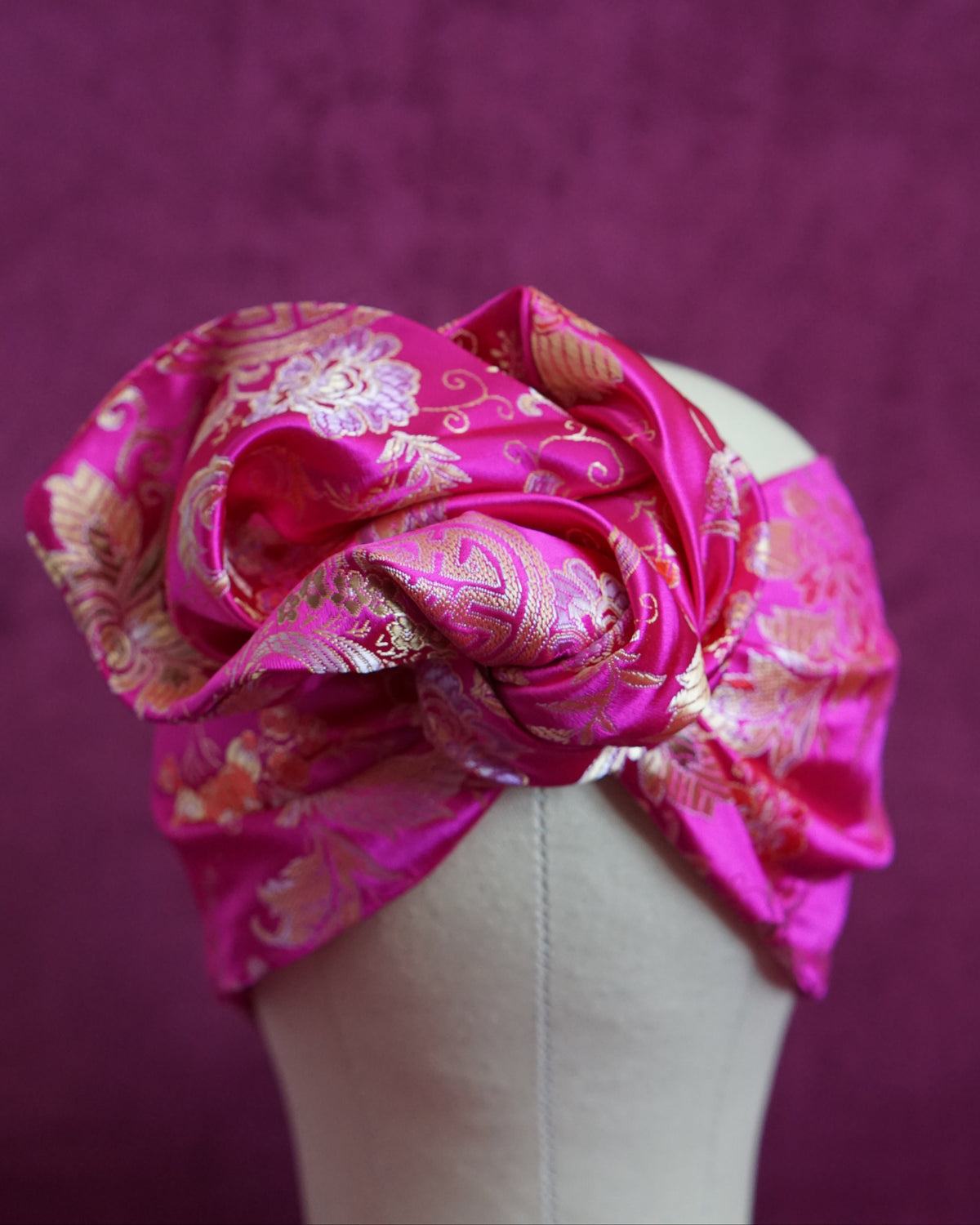 Handmade wired turban headband in fuchsia and gold satin brocade woven with lush blooms