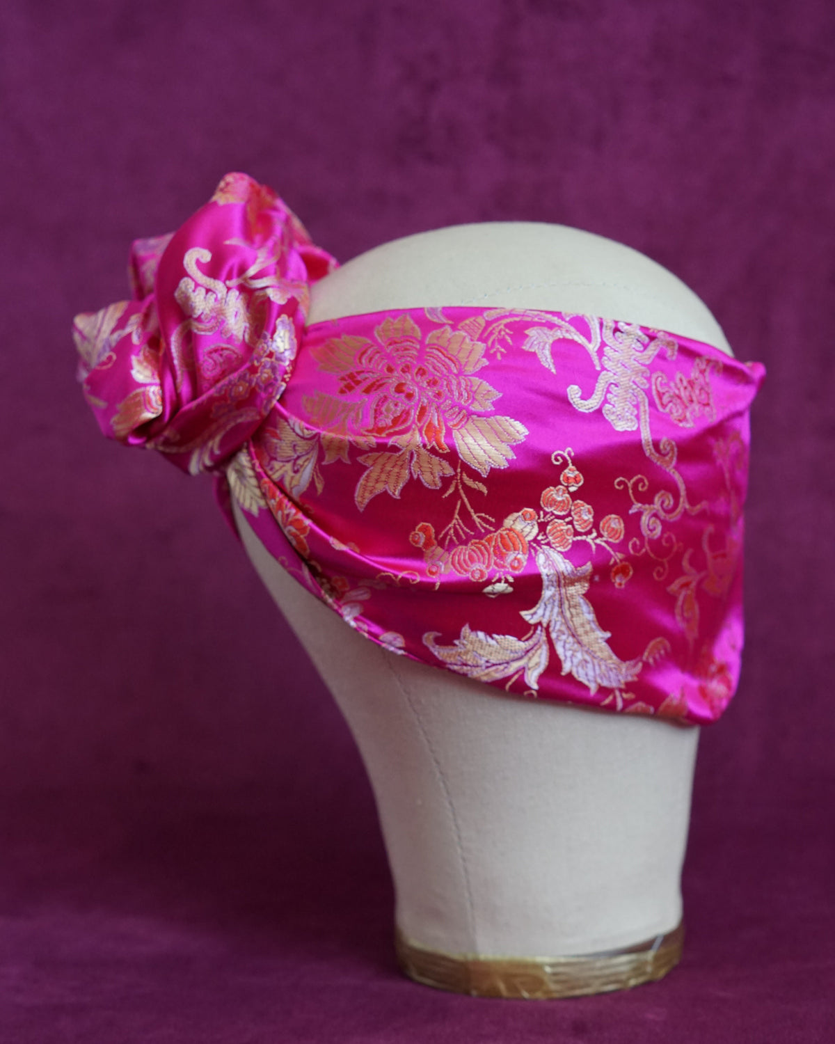 Handmade wired turban headband in fuchsia and gold satin brocade woven with lush blooms