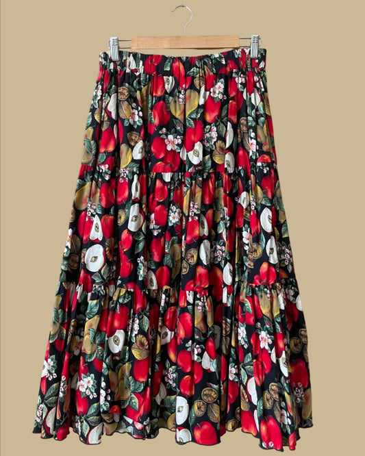 Vintage handmade tiered maxi skirt with an apple, pear, and blossom print on a black ground