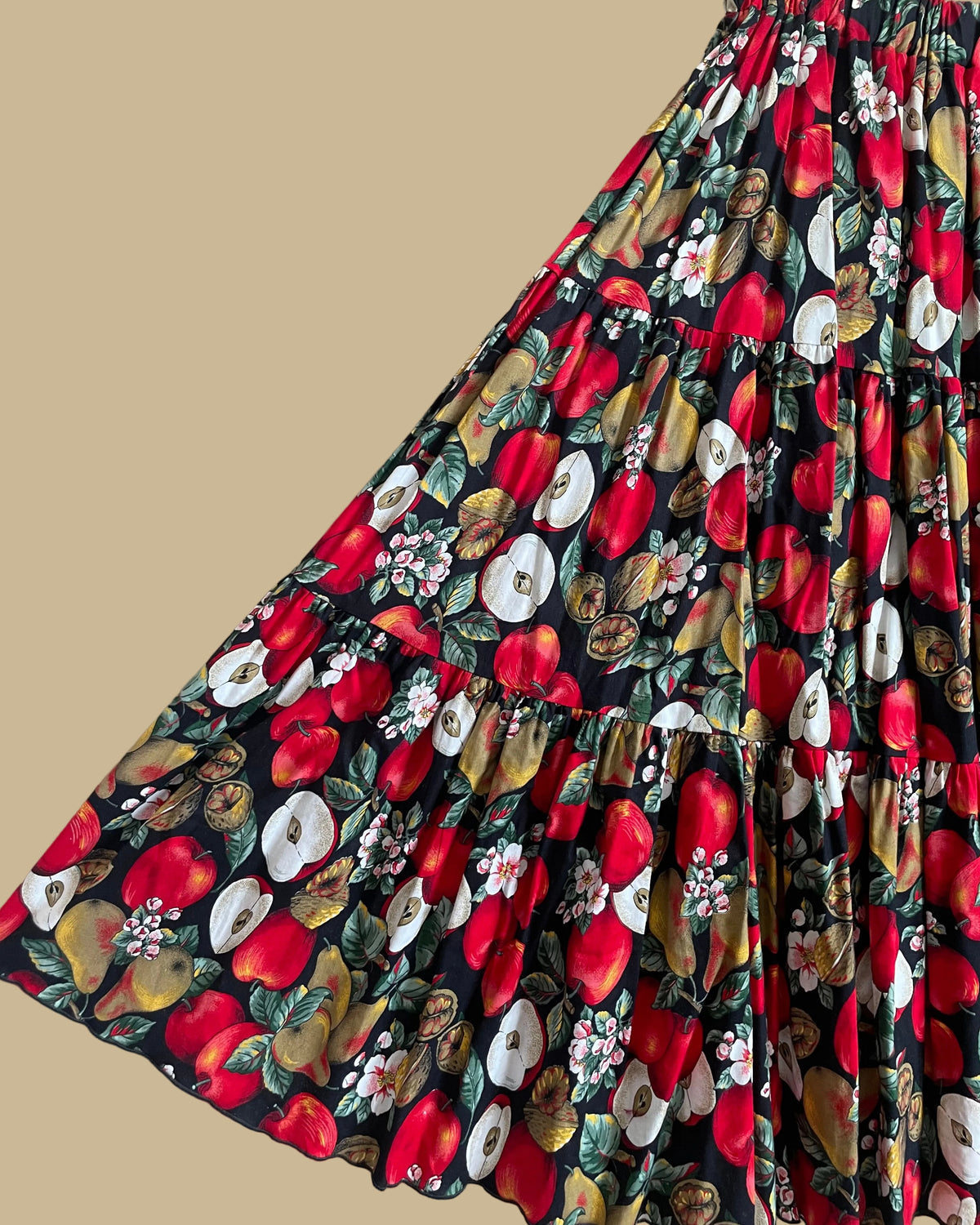 Vintage handmade tiered maxi skirt with an apple, pear, and blossom print on a black ground