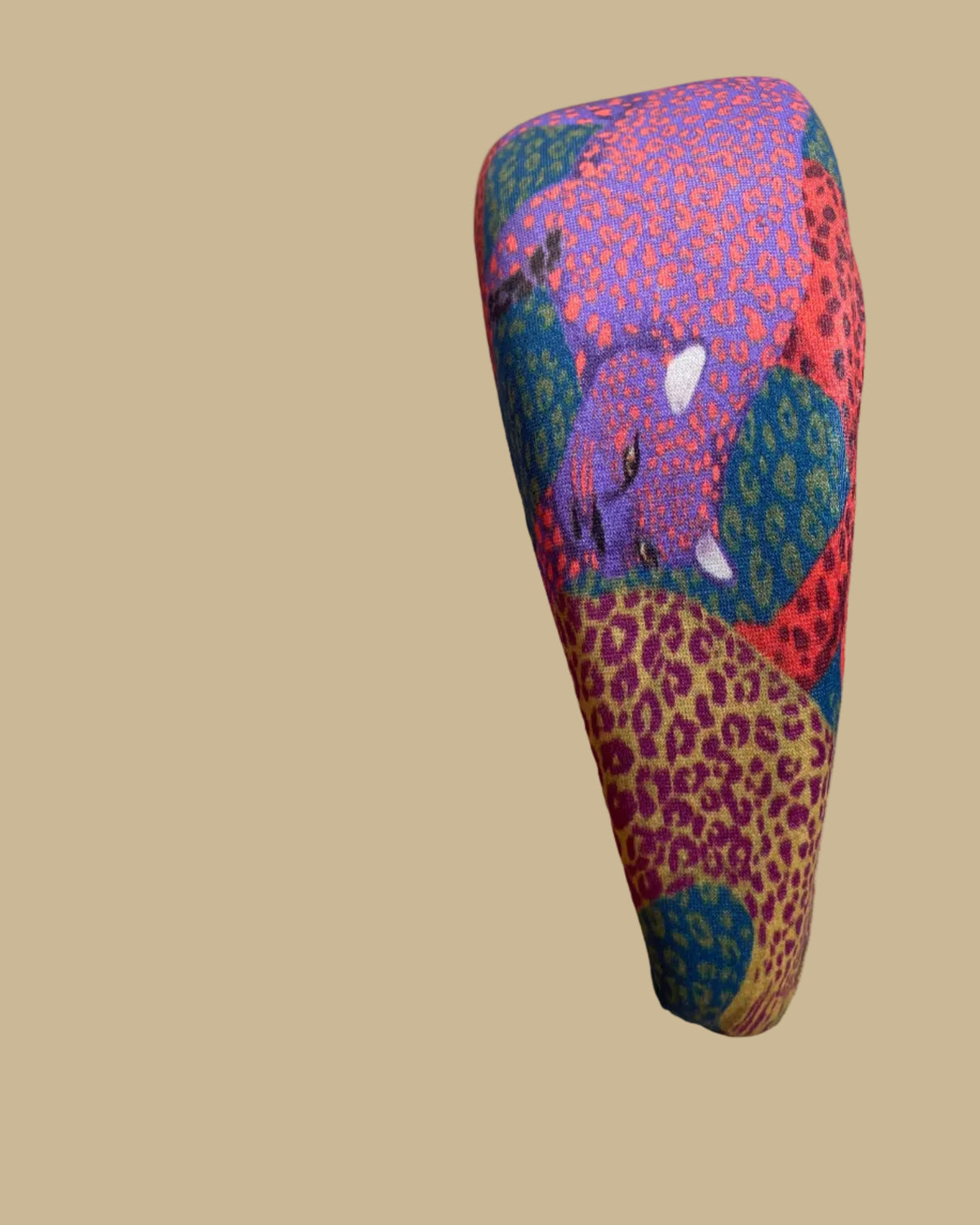 Wide padded Farm Rio headband in a patchwork of jewel-toned leopards in purple, red, teal, and olive