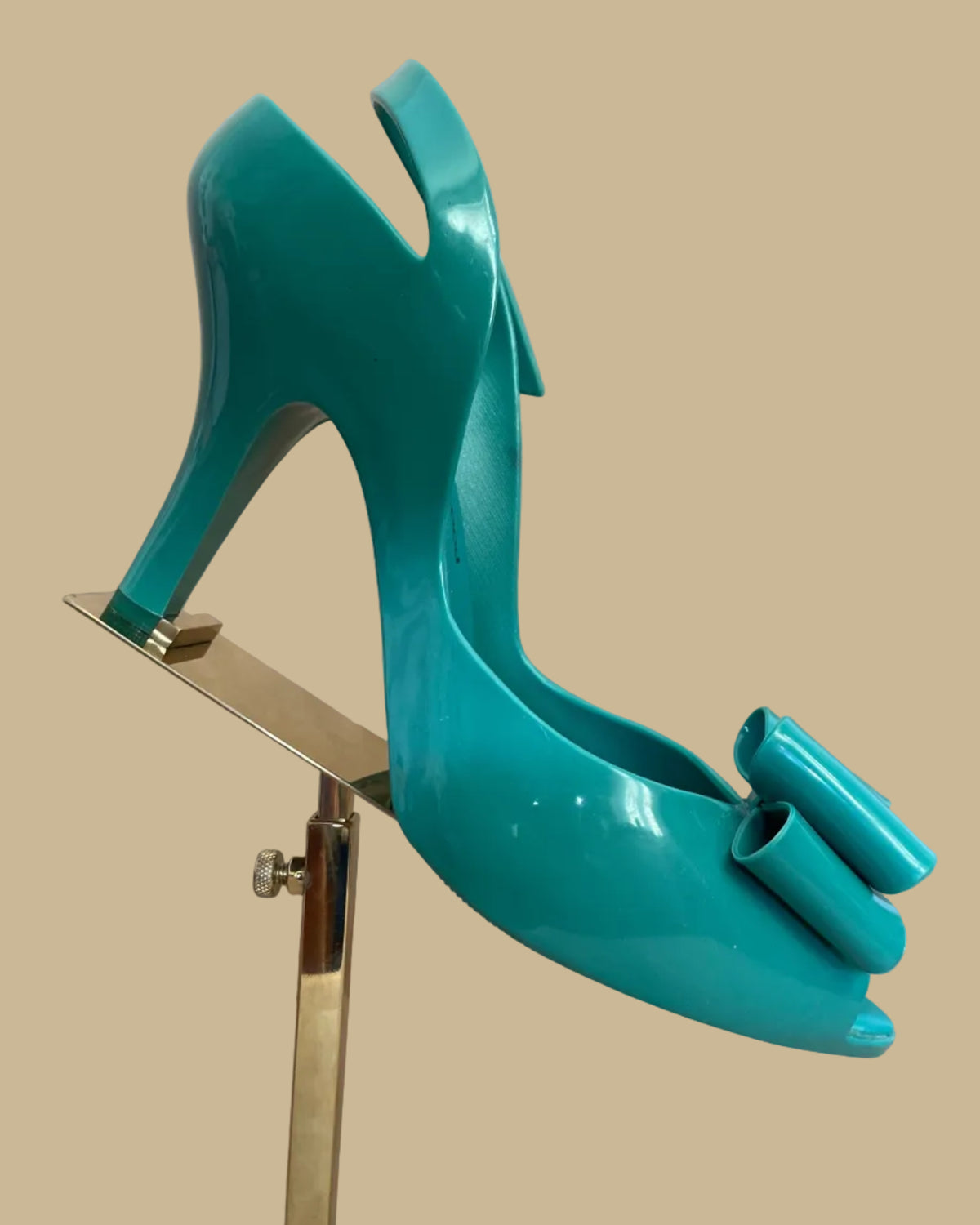 Close-up of mild scuff marks on the teal jelly heels