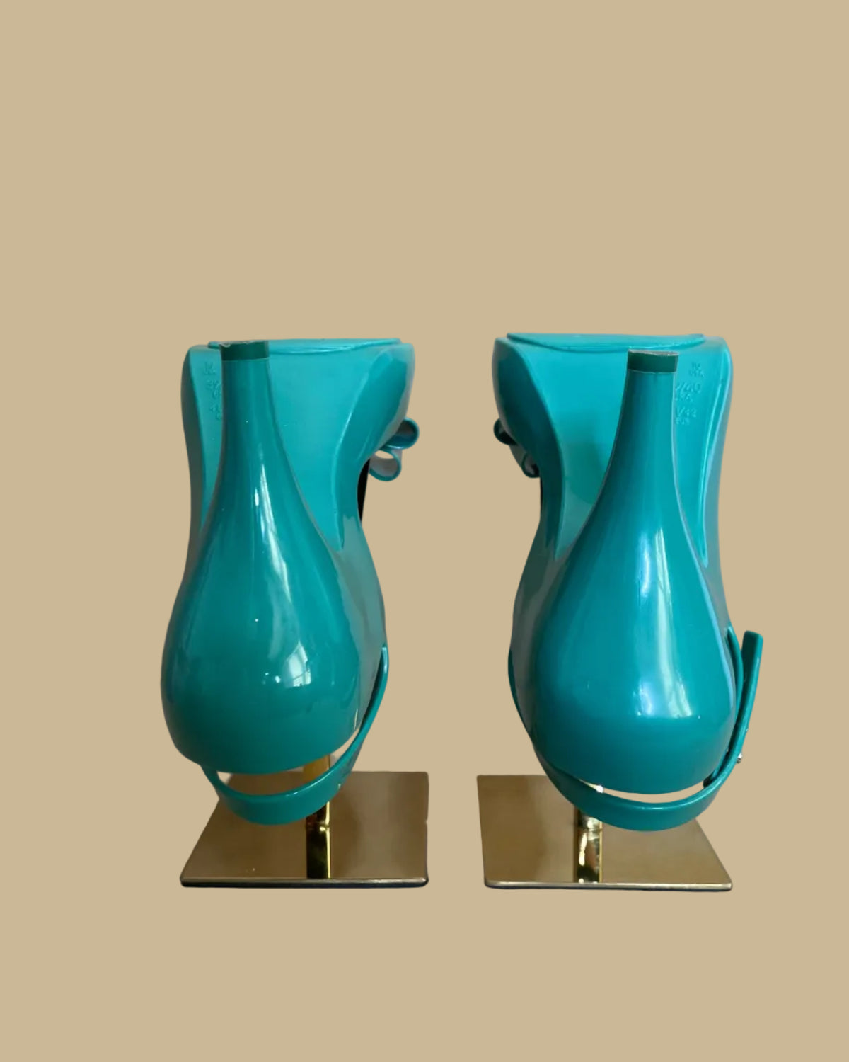 Close-up of the glossy teal jelly material texture on the heels