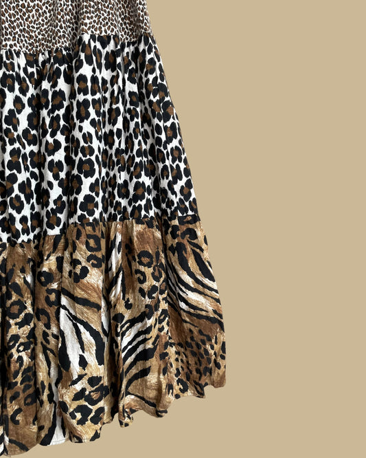 Close-up of the tiered maxi skirt showing the leopard, tiger, and zebra print panels and heavyweight fabric texture