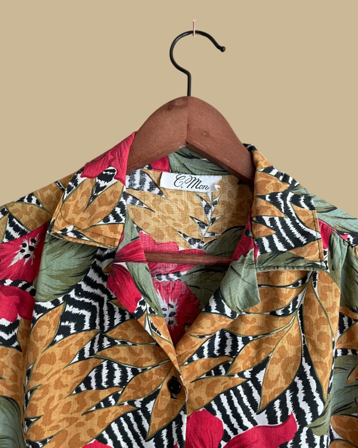 Close-up of the collar and button front on the tropical floral zebra and leopard print camp shirt