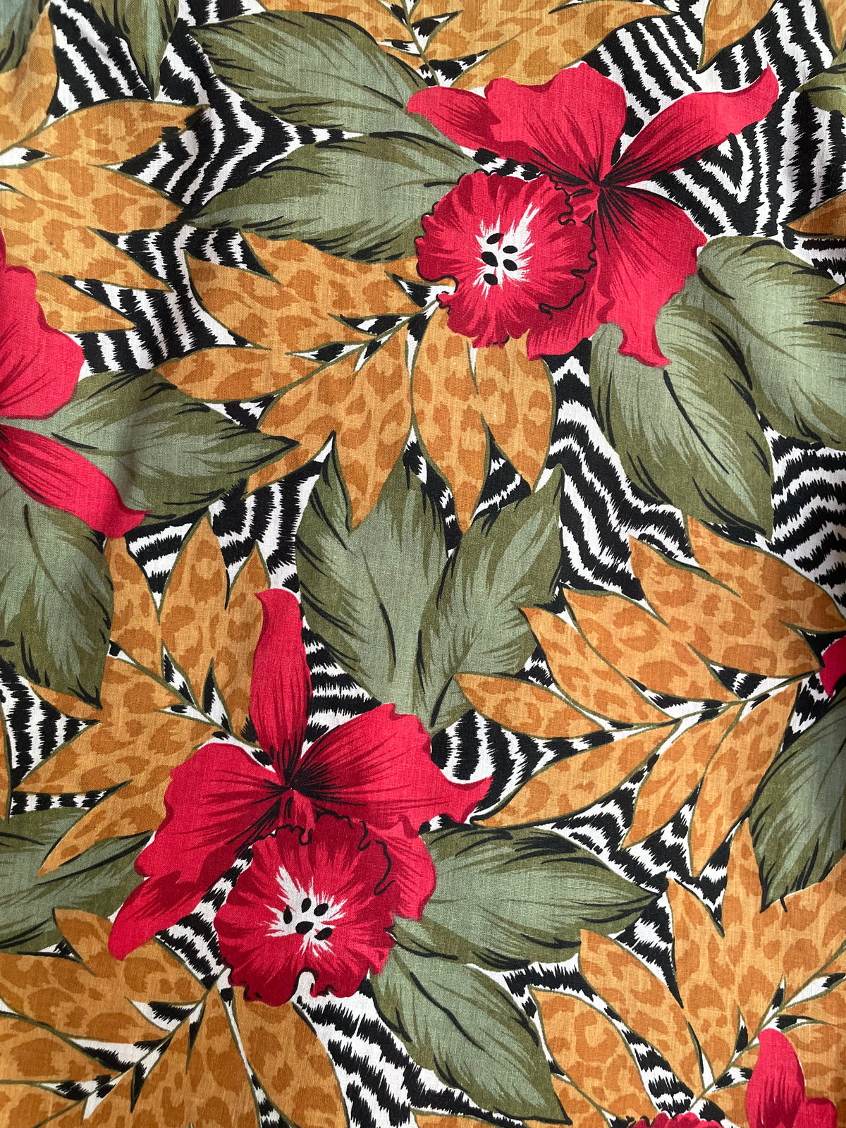 Close-up of the C. Mon brand label inside the camp shirt collar