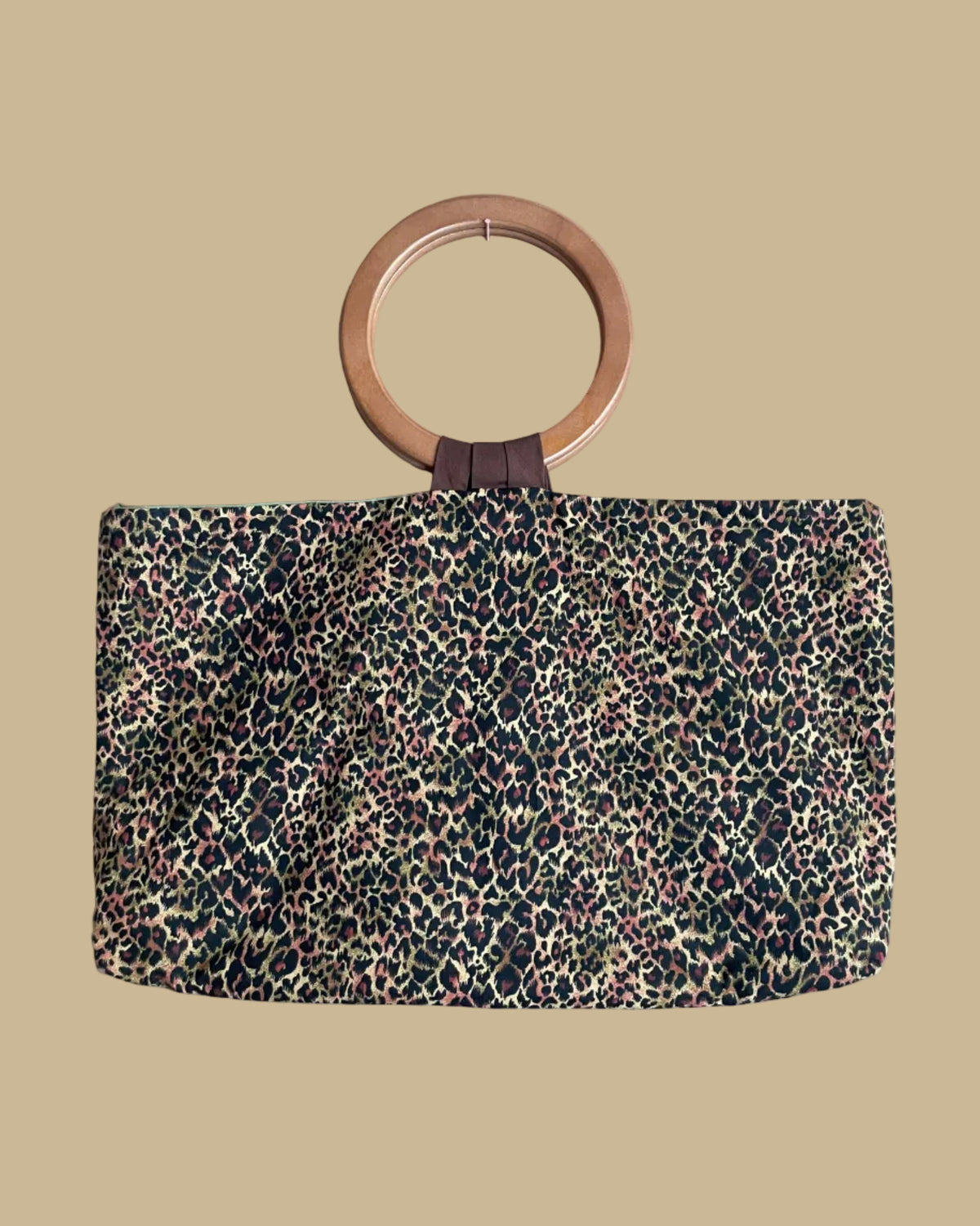 Close-up of the wooden ring handles on the reversible tote bag