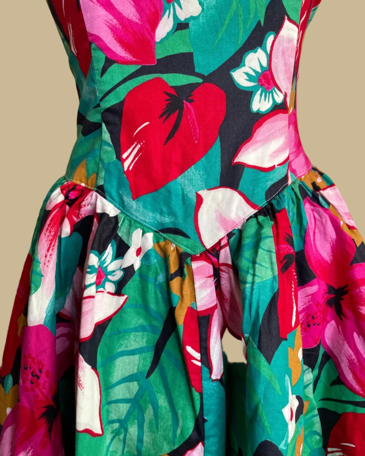 Back view of the tropical floral strapless dress showing the zip closure and smocked bodice
