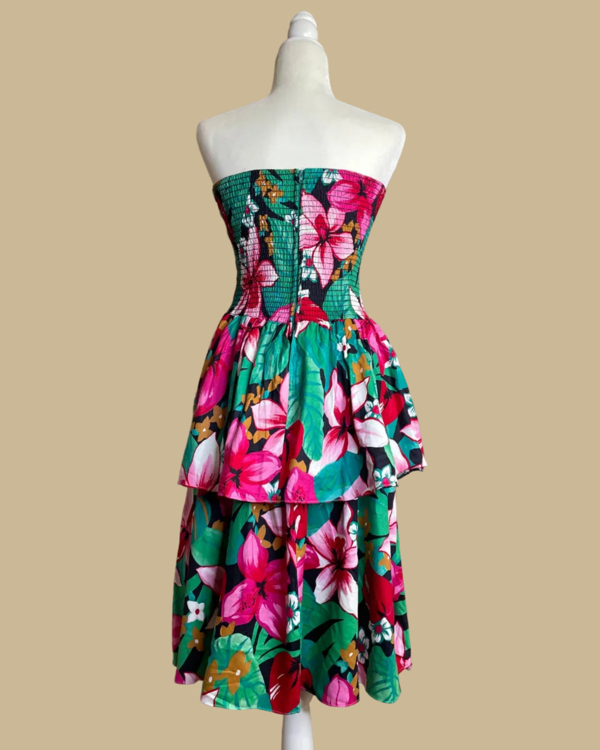 Close-up of the tiered ruffled skirt on the tropical floral strapless dress