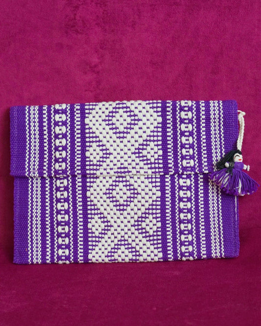 Handwoven cotton clutch in purple and cream with a raised diamond and dot pattern, sourced from Mexico City