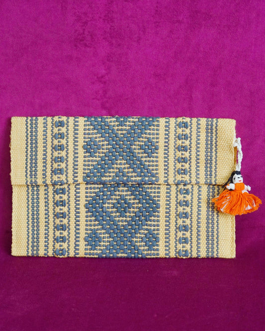 Handwoven cotton clutch in marigold and slate gray with a raised diamond and dot pattern, sourced from Mexico City