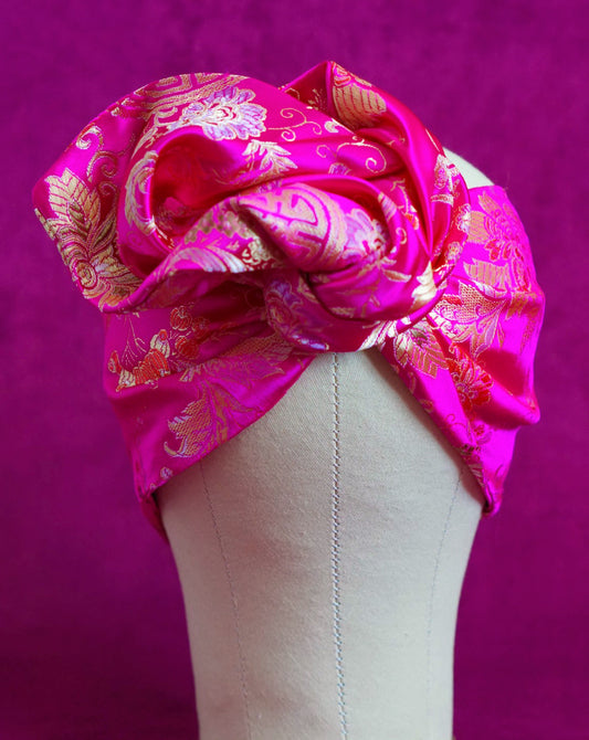 Handmade wired turban headband in fuchsia and gold satin brocade woven with lush blooms