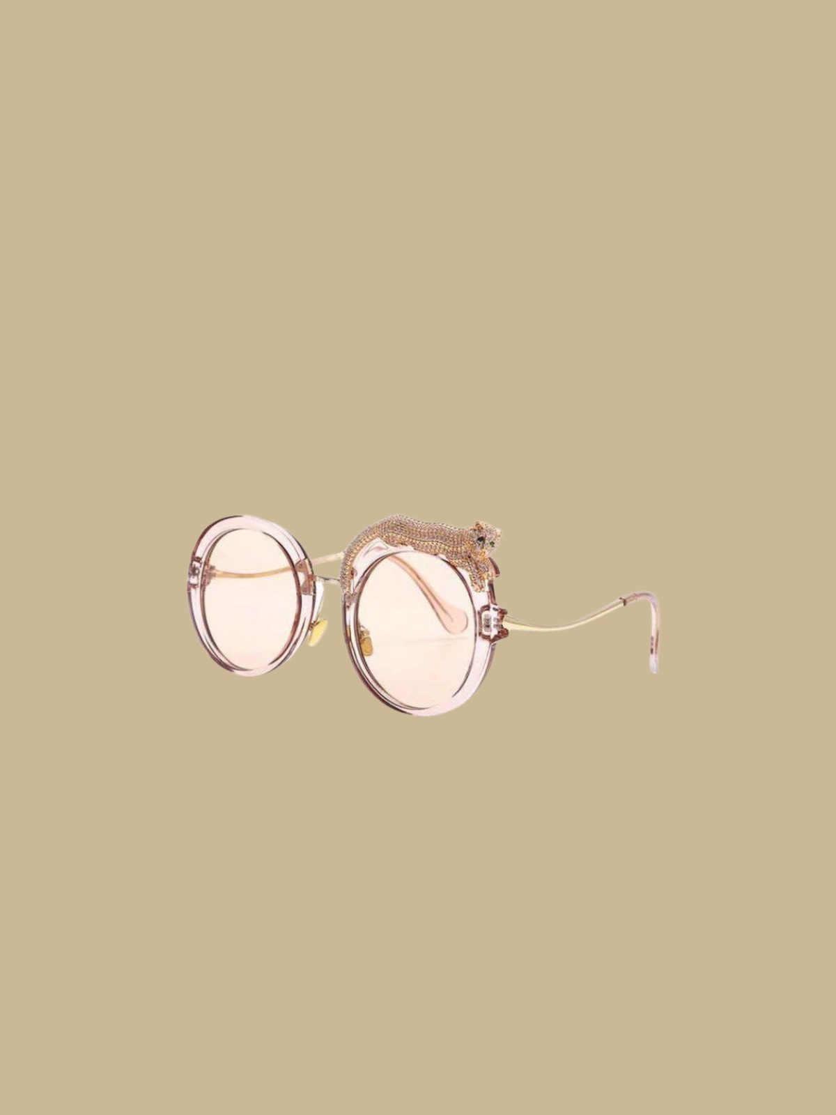 Close-up of the jeweled leopard detail on the Fierce Feline Rosé Champagne sunglasses