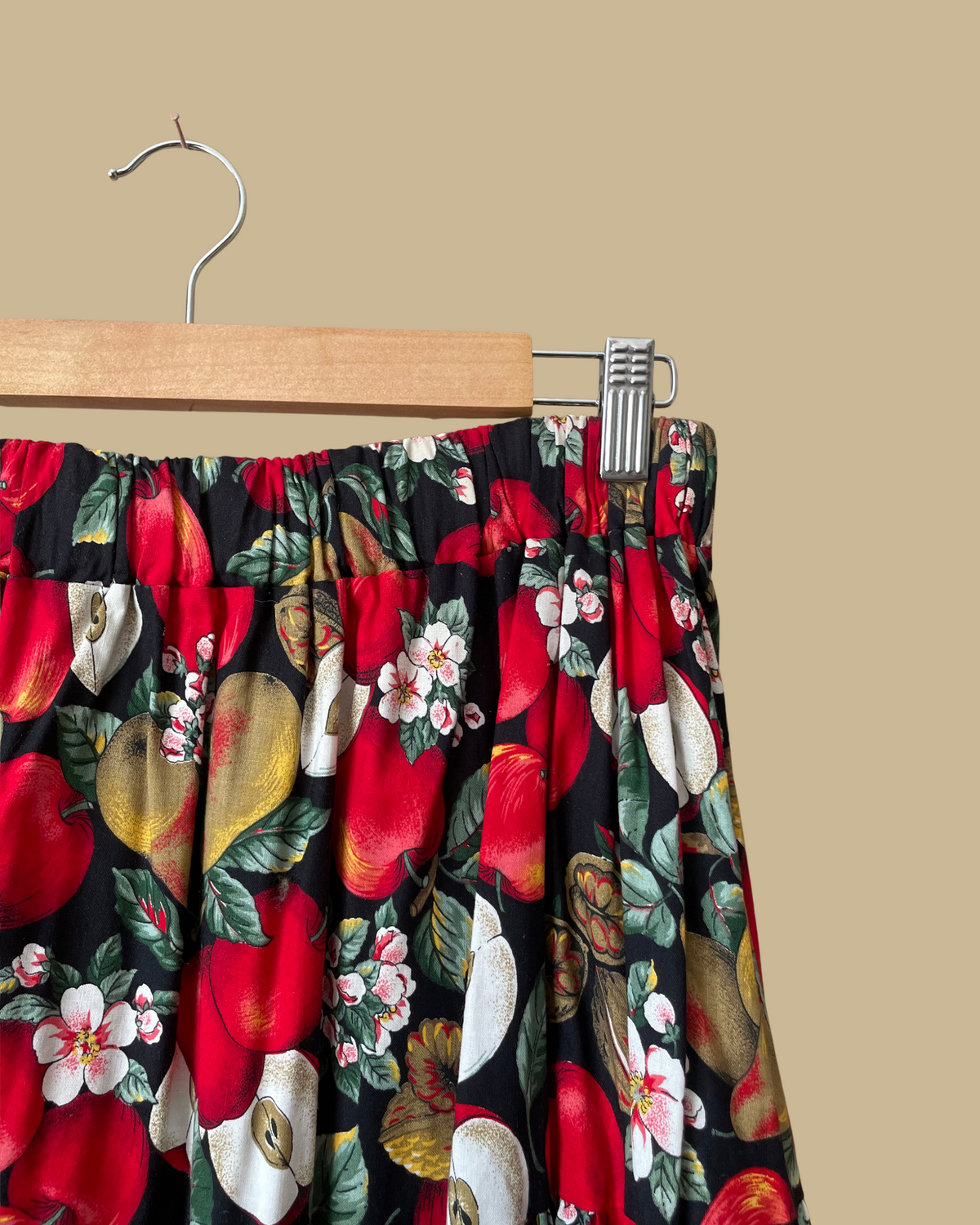 Vintage handmade tiered maxi skirt with an apple, pear, and blossom print on a black ground