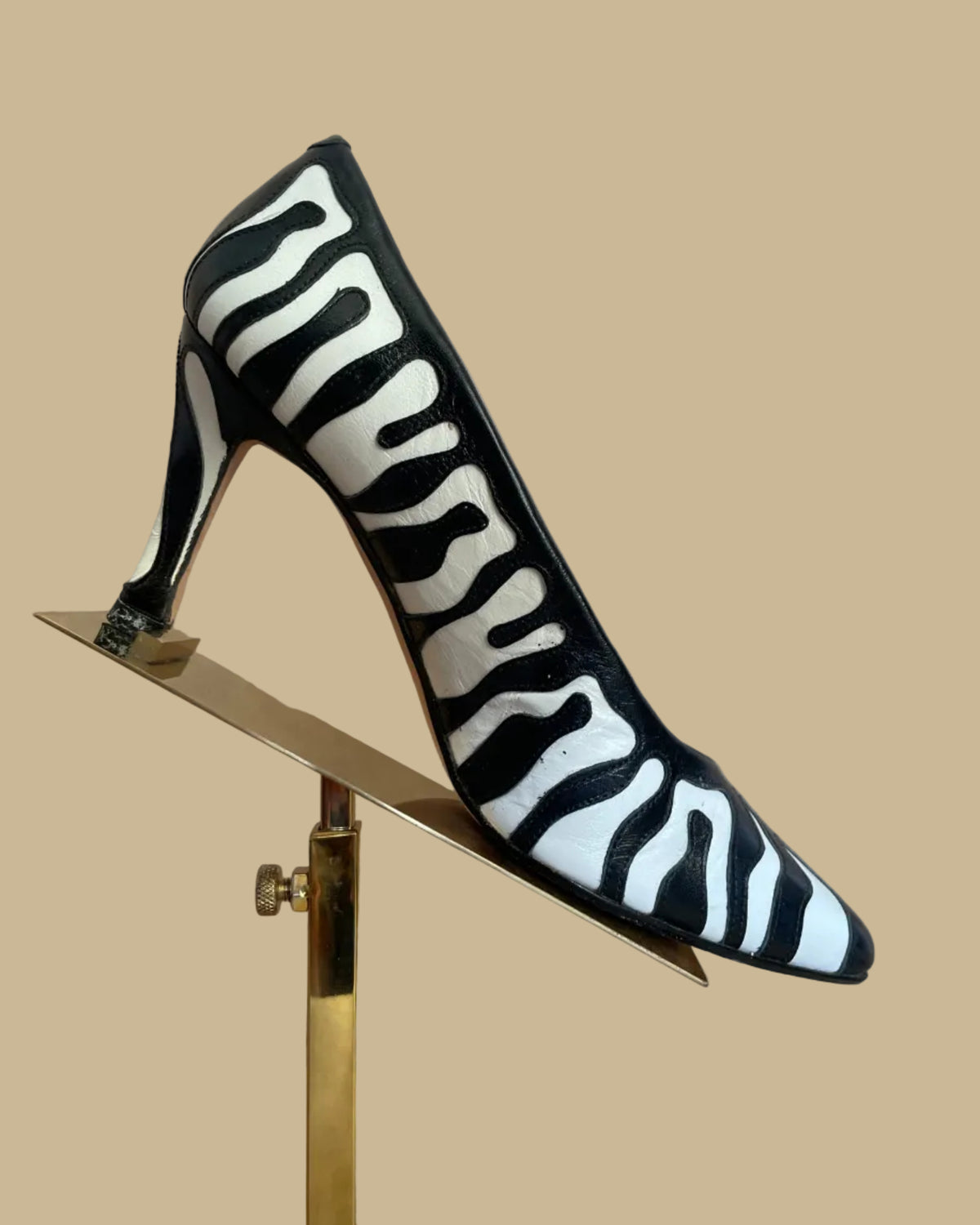 Close-up of the Zalo brand label on the insole of the zebra print heels