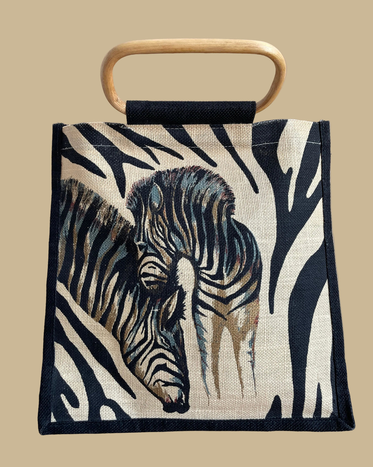 A vintage handmade zebra print canvas tote bag with bamboo handles and a fabric shoulder strap, shown against a kraft background