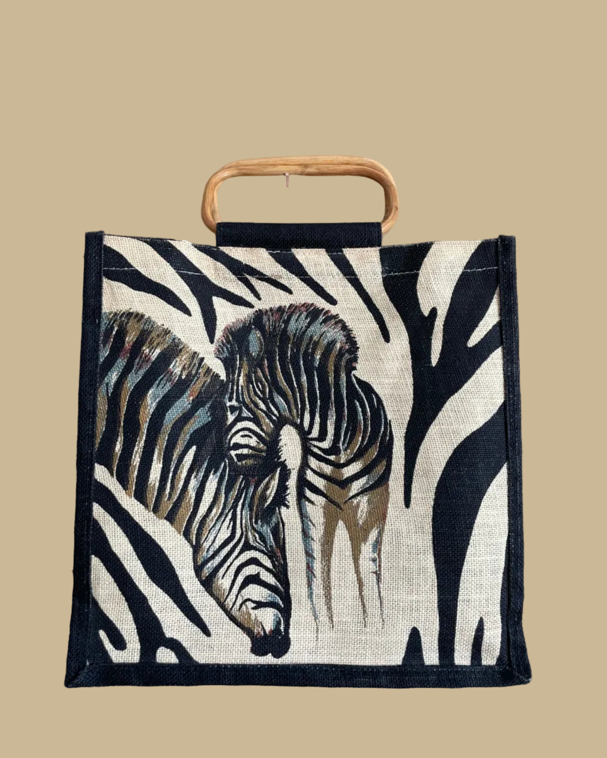 A vintage handmade zebra print canvas tote bag with bamboo handles and a fabric shoulder strap, shown against a kraft background