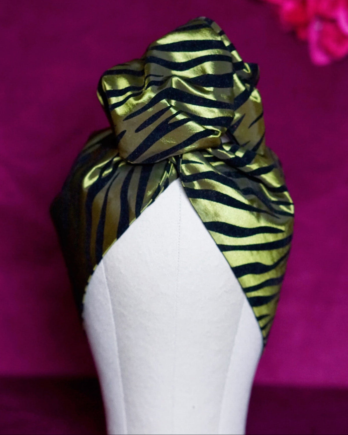 Metallic green zebra print wired turban headband by Lillian & Joan