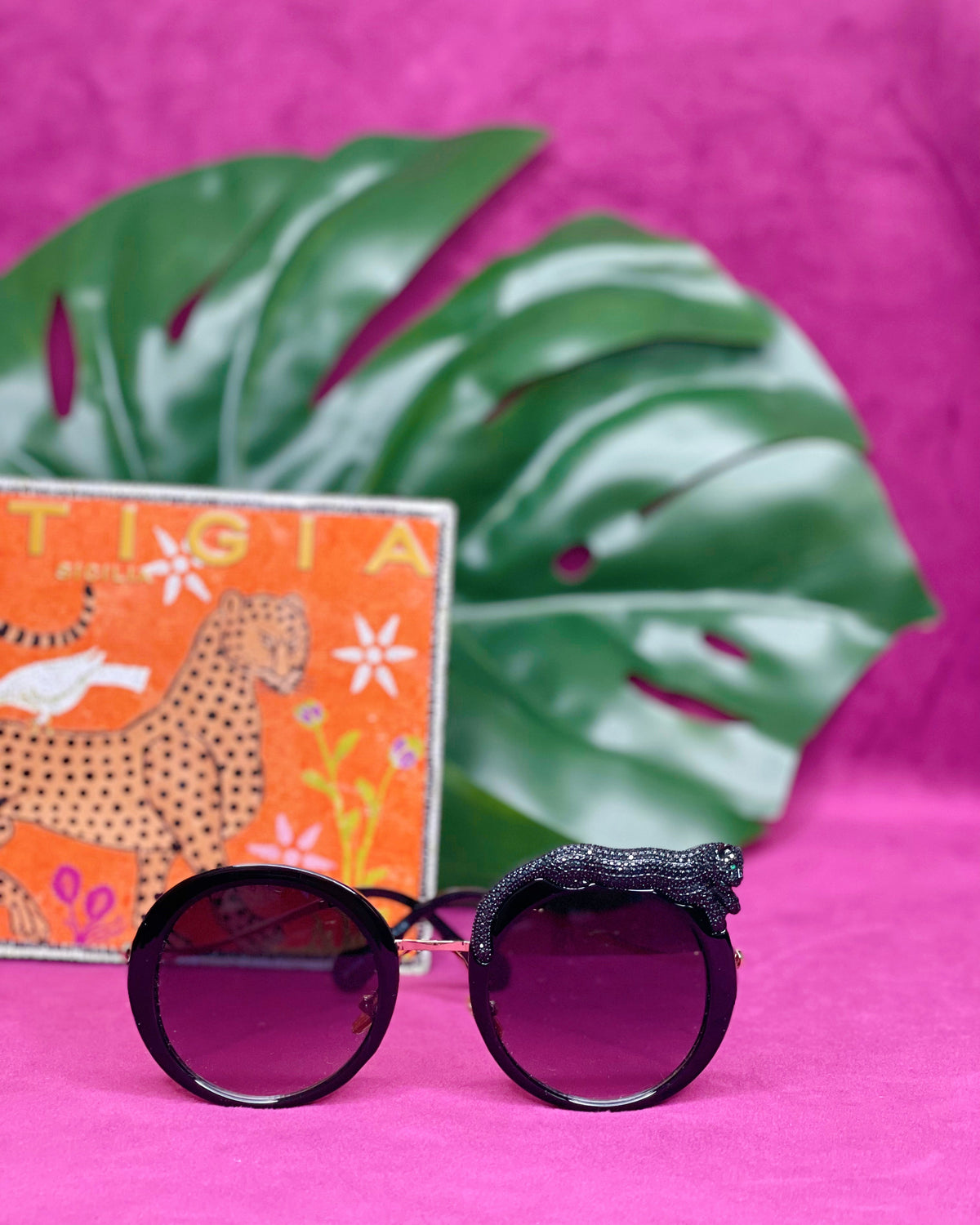 Side view of the Fierce Feline Onyx Black sunglasses showing the cat figure and lens