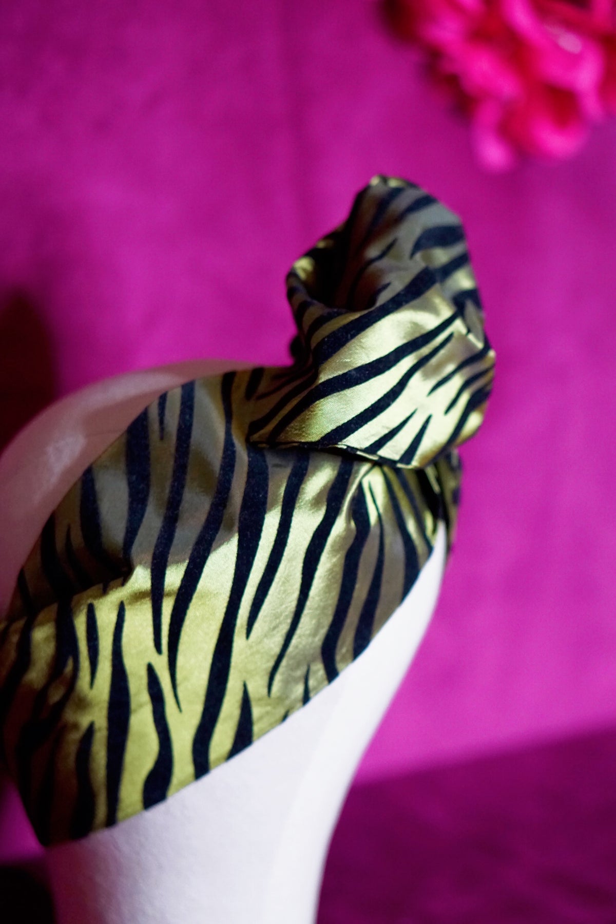 Metallic green zebra print wired turban headband by Lillian & Joan