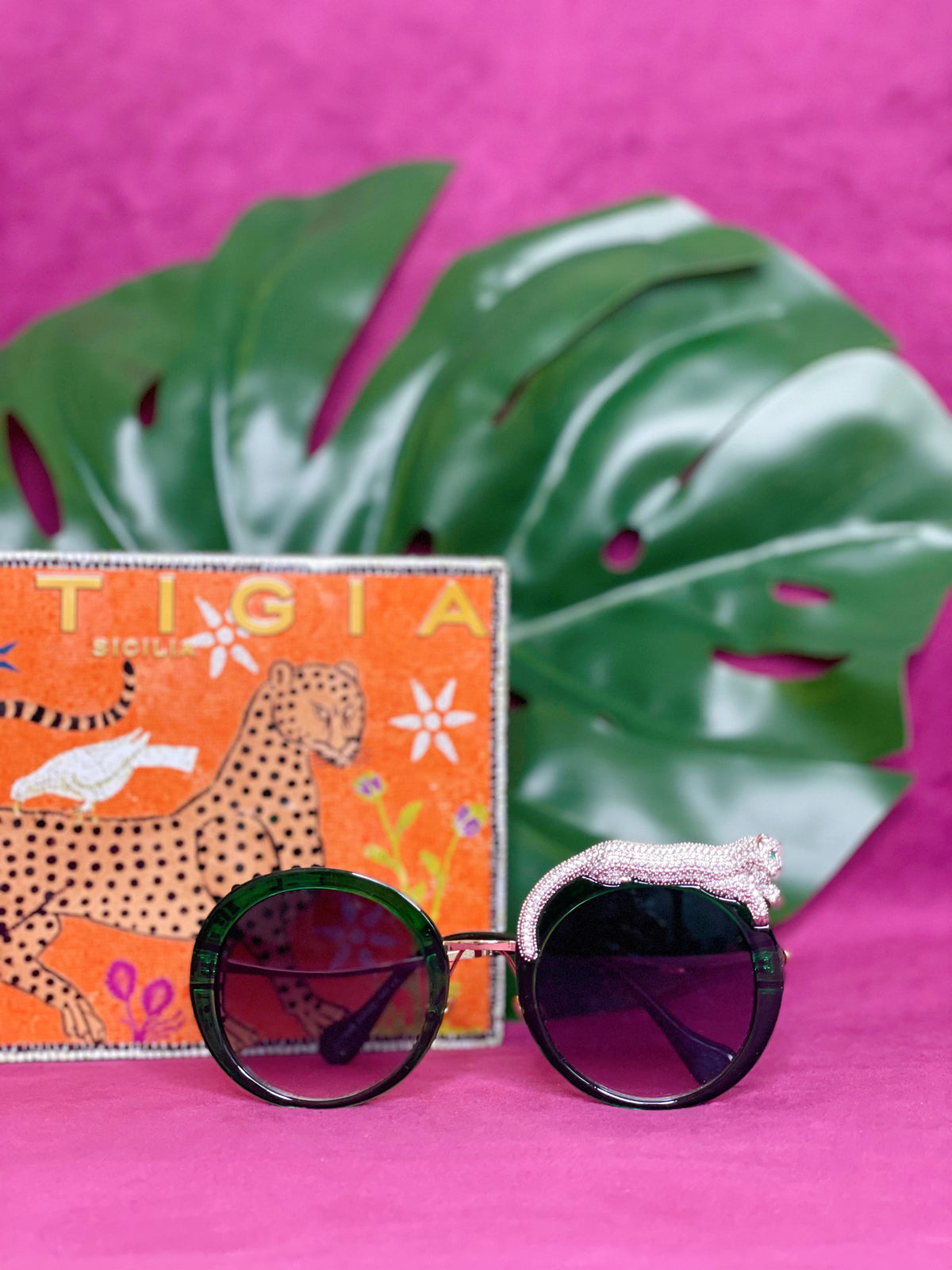 Side view of the Fierce Feline Malachite Green sunglasses showing the leopard figure and lens